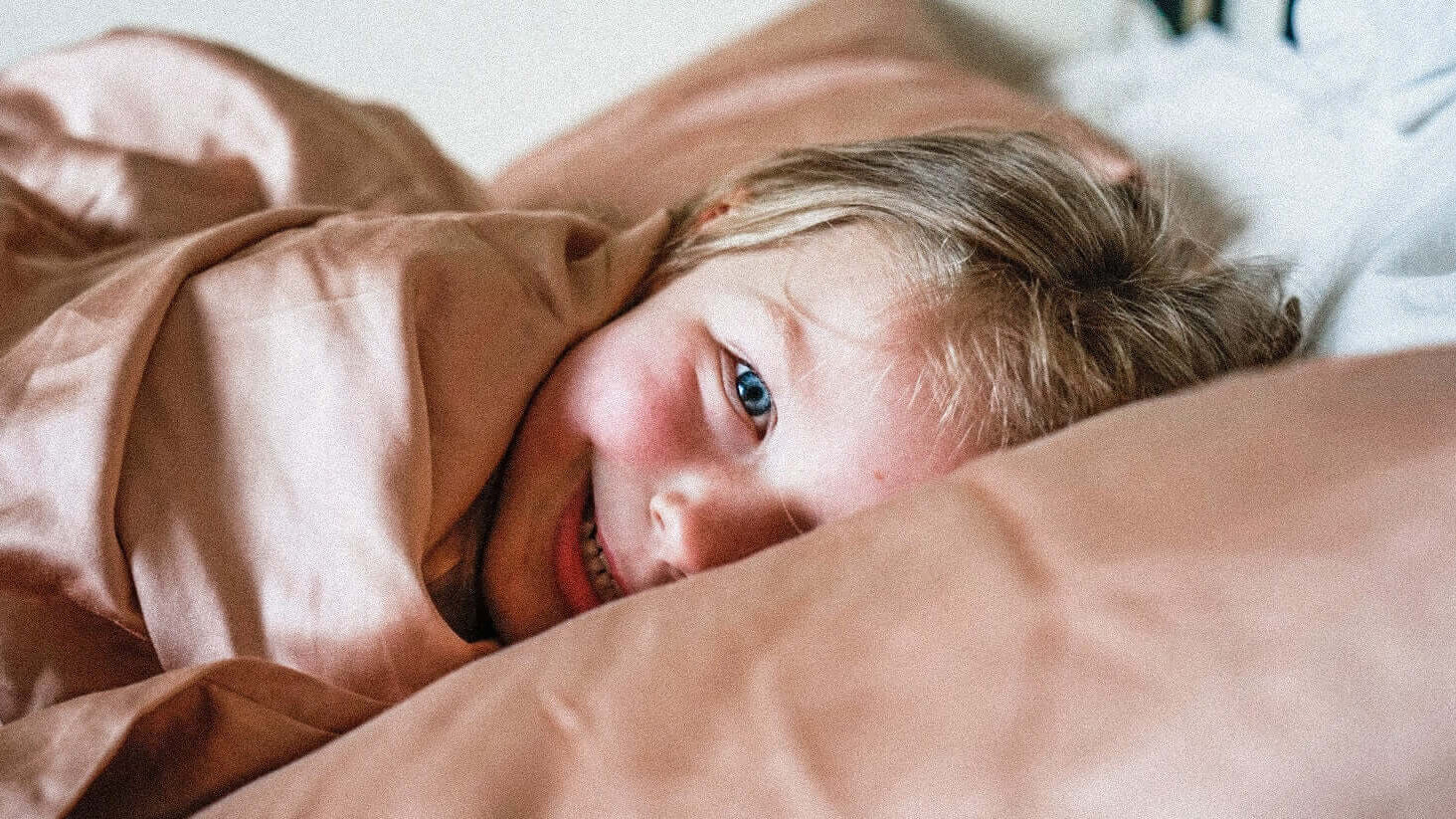 kid wrapped up in kids bamboo duvet