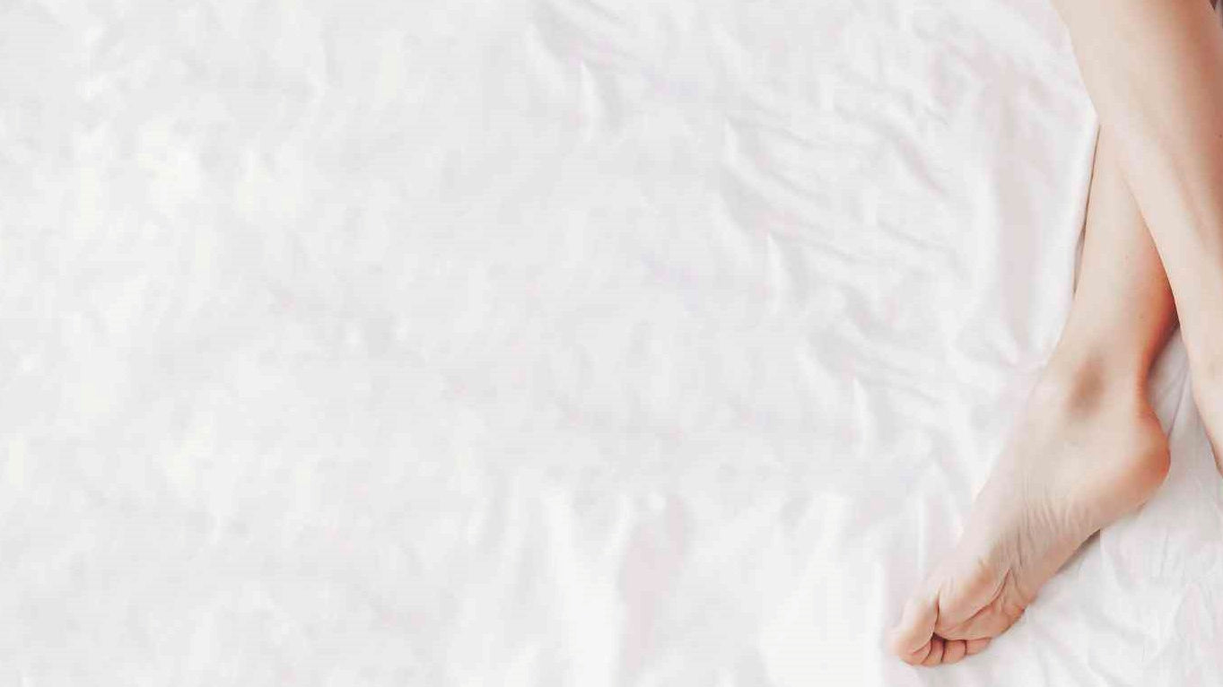 naked legs on the bed