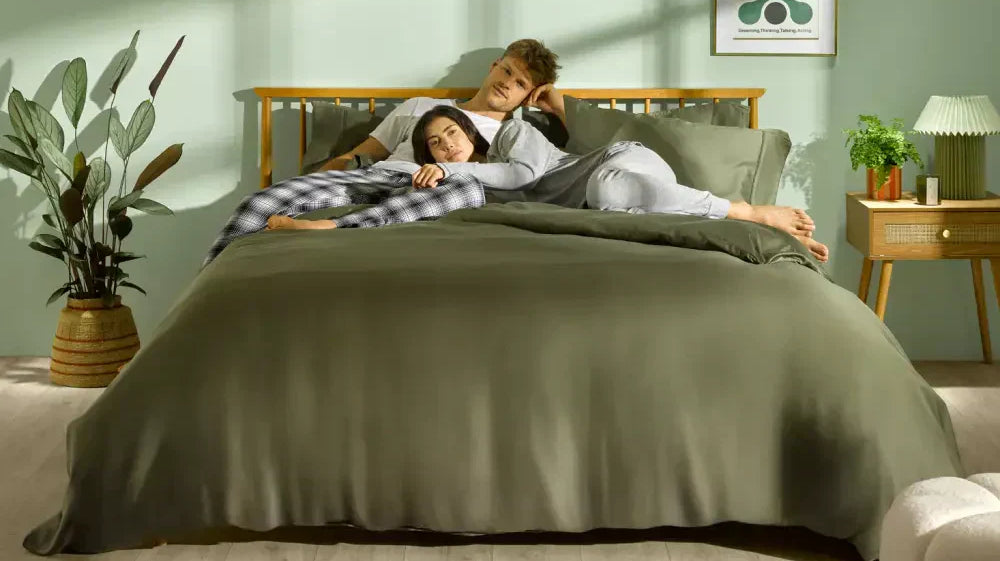 COUPLES ON A FOREST GREEN BAMBOO SINGATURE PLUS BEDDING