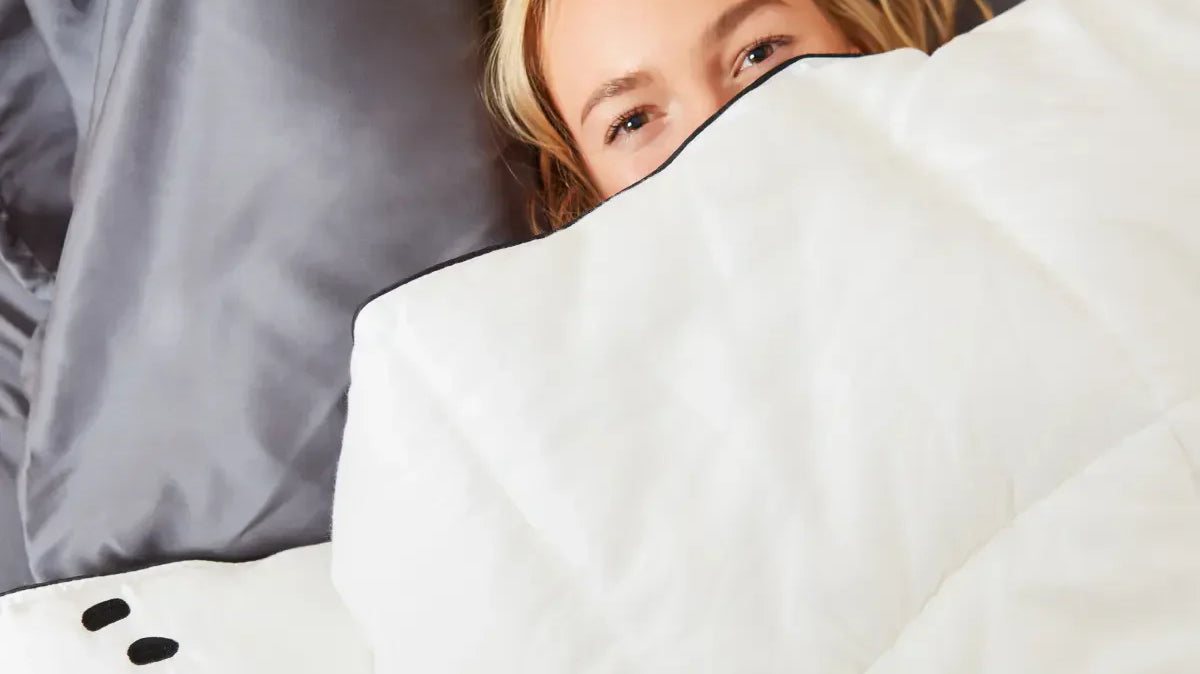 woman covering her face with Panda bamboo duvet