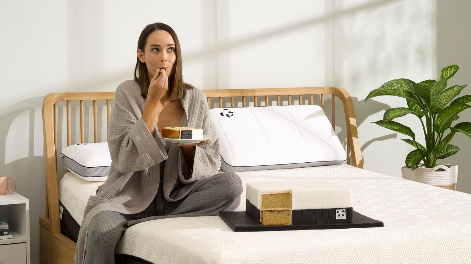 woman eating cake on the bed