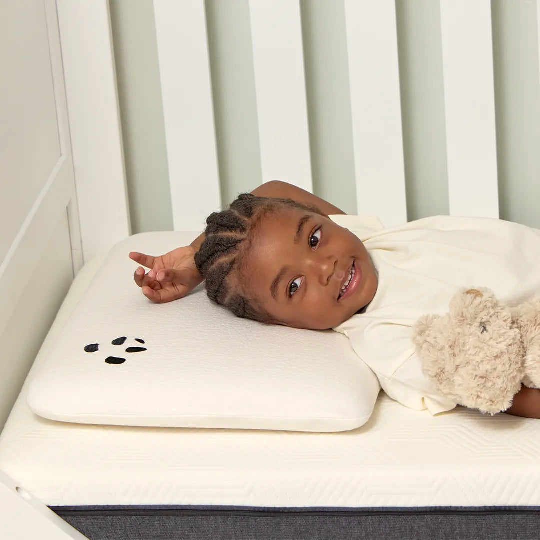 Kid laying on a Toddler Bamboo Panda Pillow