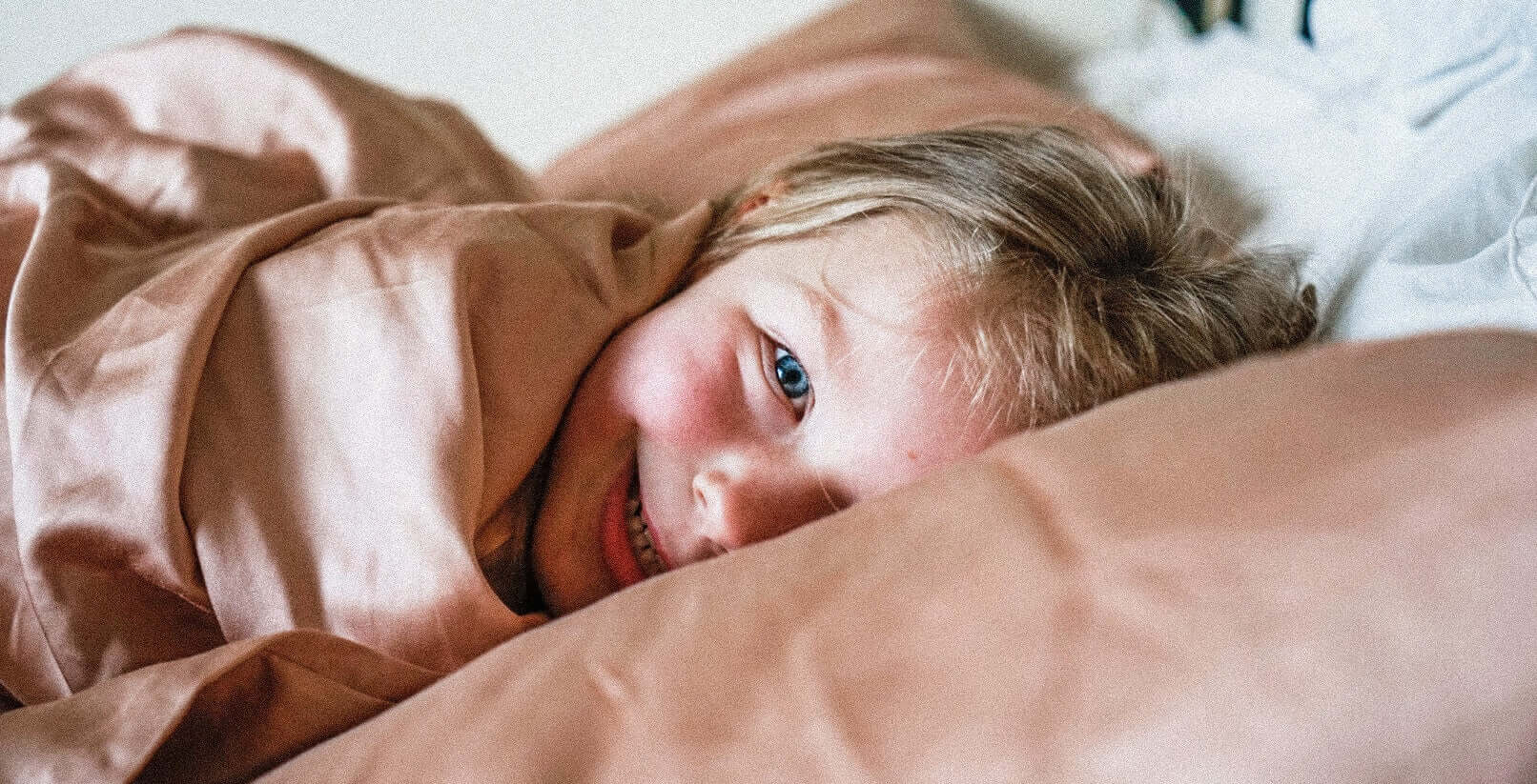 kid wrapped up in kids bamboo duvet 