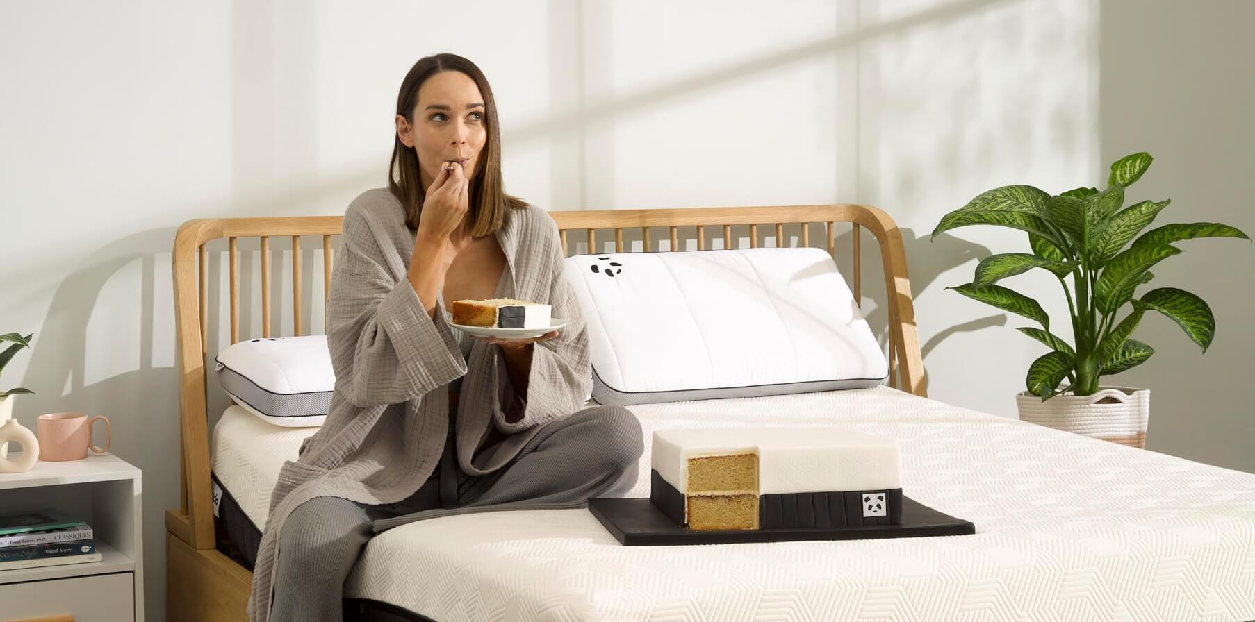 woman eating cake on the bed