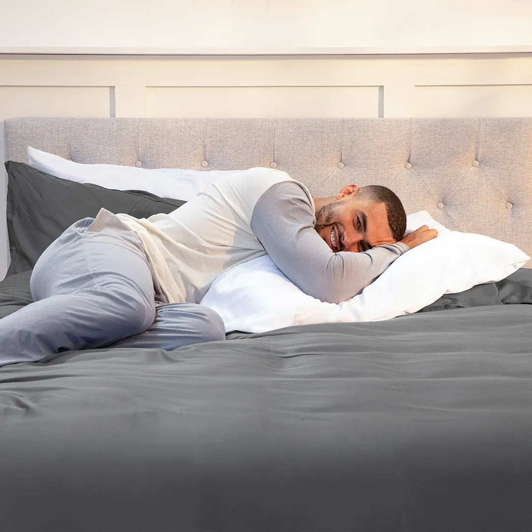 [BBGrey] 100_Bamboo_Bedding_Set_Quiet_Grey_0guy laying and smiling 