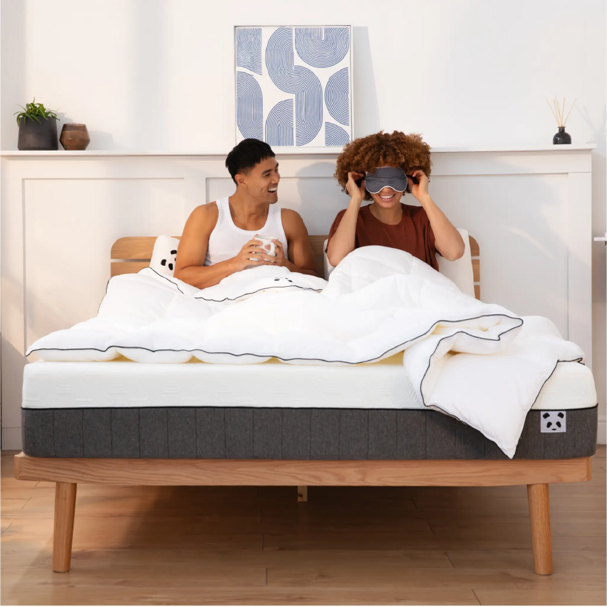 [HybridBambooMattressUpdated] Woman with an eye mask with a guy on a Panda London Bamboo mattress 