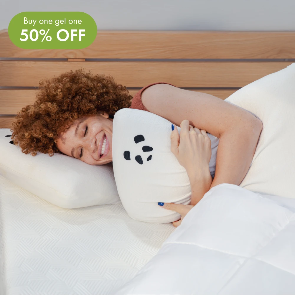 [MemoryFoamPillow] Woman laying on the bed laughing holding memory foam panda bamboo pillow
