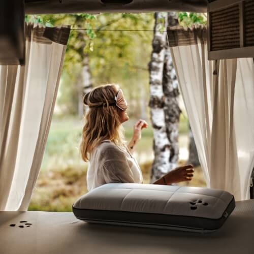 Woman with eye mask in campervan