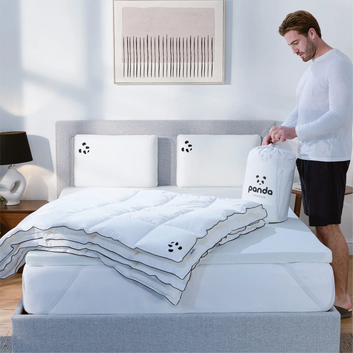 [Cloud3in1] A man standing and opening a Panda London Duvet 3in1