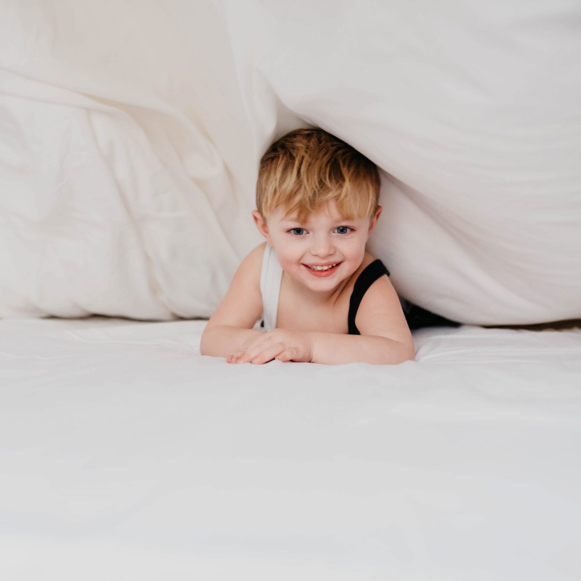 [DCPinkKids] Boy smiling on the bamboo bedding