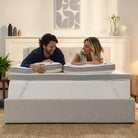 [all] Couple enjoying a comfortable sleep on a Hybrid Mattress Topper, showcasing the topper's plush bamboo design.