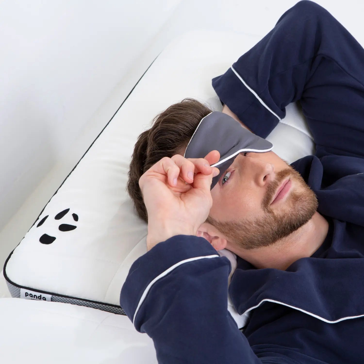 [UKSinglePureWhiteCloudDuvetBundle] Guy Smiling while holding Bamboo Eye Mask