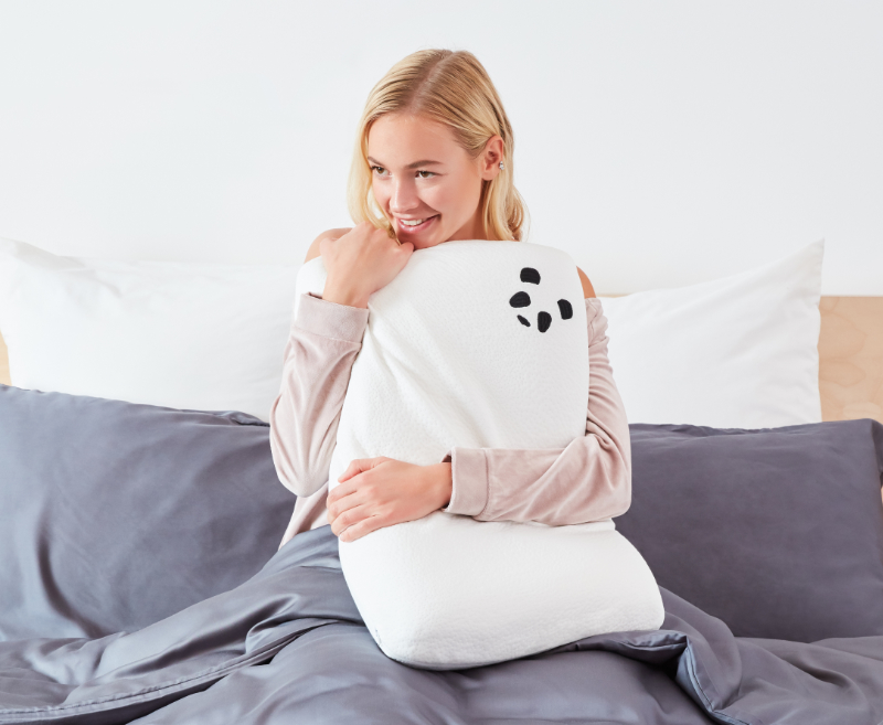 Woman Holding Panda Memory Foam Pillow on 100 Bamboo Bedding