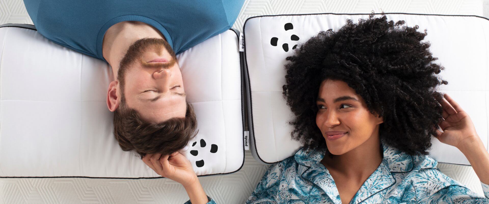 couple laying on a bamboo hybrid pillow