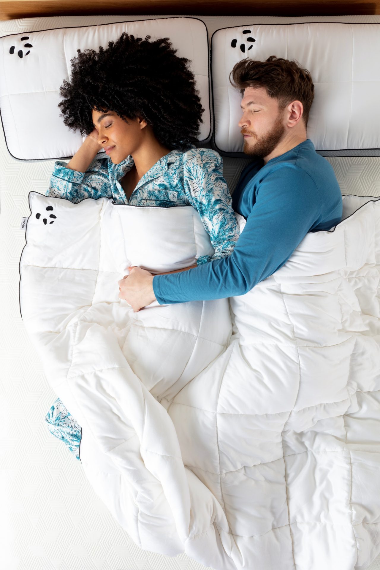 couple sleeping on a hybrid mattress
