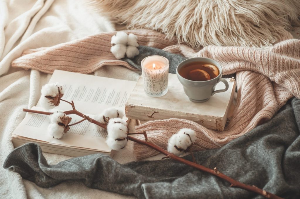 hot tea with a book on a winter day lifestyle image