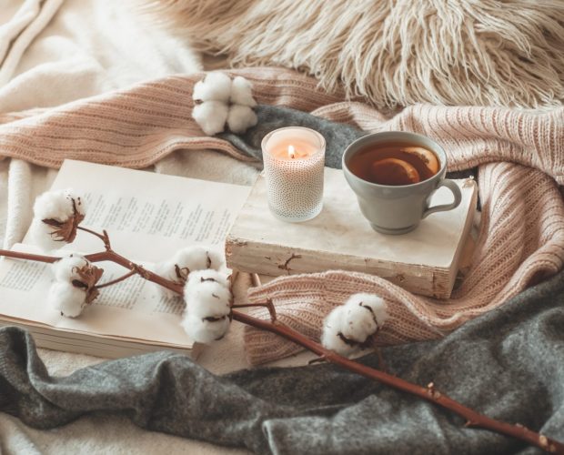 hot tea with a book on a winter day lifestyle image