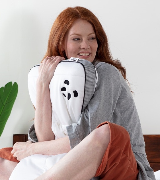 woman hugging hybrid bamboo pillow