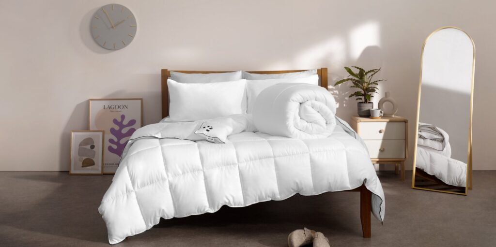 Cloud Bamboo Duvet on Bed - Rolled - Logo Shown - Lifestyle Image