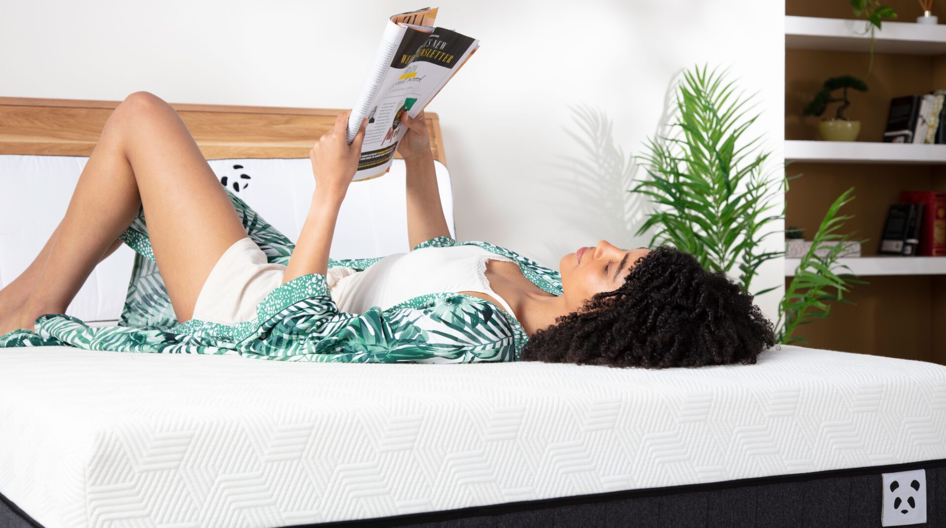 Hybrid Bamboo Mattress Woman laying on the bed reading